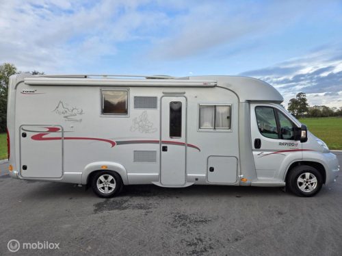 RAPIDO 7096+ 2008, 129 pk ☆2xAirco, Zonnepanelen, XL-garage☆ foto: 2