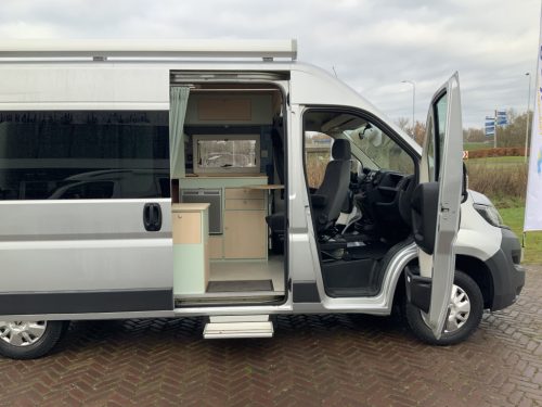 Peugeot Boxer L2 H2 Camper Van: Euro 6 with lowerable table for 2 people. longitudinal bed, 154 cm width, 185 cm length, FSL Camper conversion 2021, km 66000, Swiveling bicycle rack, Solar panel 180W, Year 2017 Camper centrum on the road photo: 1