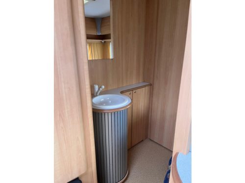 HOME-CAR Racer 45 Spirit | French bed | Dinette | Front bicycle rack | Heater | Refrigerator | Toilet and sink photo: 15