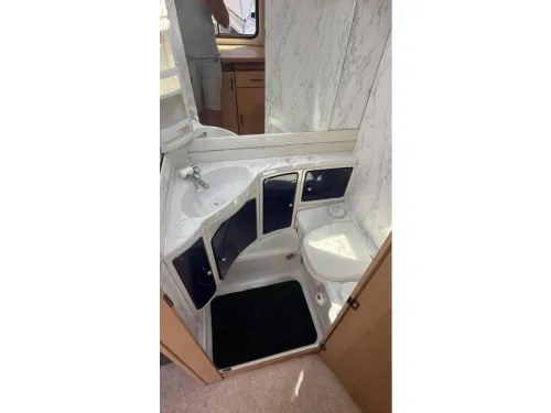 TEC Tour 450 standard seating bed toilet photo: 2