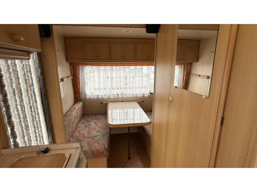 Adria Optima 425 TK fixed bed seating toilet room photo: 1