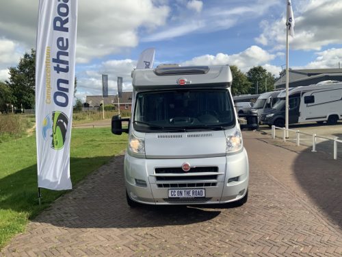 B&uuml;rstner Travel Van 2.3 MultiJ. 130 HP Semi-integrated. Engine air conditioning, Garage, 2 single beds, Length 6.70 m., etc. Year of manufacture 2013 Motorhome center on the road photo: 2