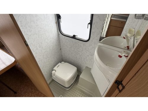 Adria Optima 425 TK fixed bed seating toilet room photo: 6