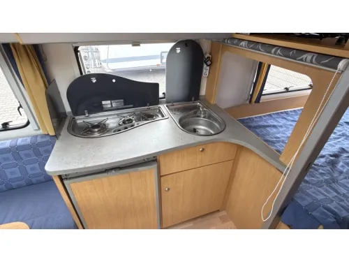 Knaus Sudwind 450 FU French bed dinette toilet photo: 4