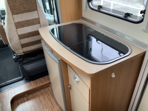 B&uuml;rstner Nexxo 569 Semi-integrated, Train seat, French bed, two swivel chairs, small camper, Year 2010 Camper centrum on the road photo: 13