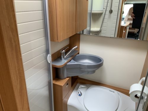 B&uuml;rstner Nexxo 569 Semi-integrated, Train seat, French bed, two swivel chairs, small camper, Year 2010 Camper centrum on the road photo: 25
