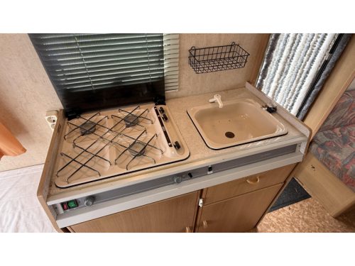 Adria Optima 425 TK fixed bed seating toilet room photo: 8