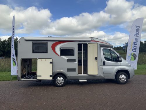 B&uuml;rstner Travel Van 2.3 MultiJ. 130 HP Semi-integrated. Engine air conditioning, Garage, 2 single beds, Length 6.70 m., etc. Year of manufacture 2013 Motorhome center on the road photo: 3