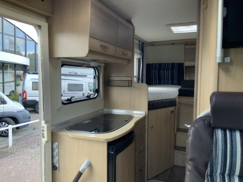 B&uuml;rstner Travel Van 2.3 MultiJ. 130 HP Semi-integrated. Engine air conditioning, Garage, 2 single beds, Length 6.70 m., etc. Year of manufacture 2013 Motorhome center on the road photo: 14